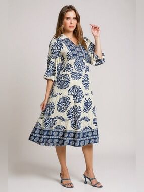 Cream midi dress with navy and tan abstract print and border trim